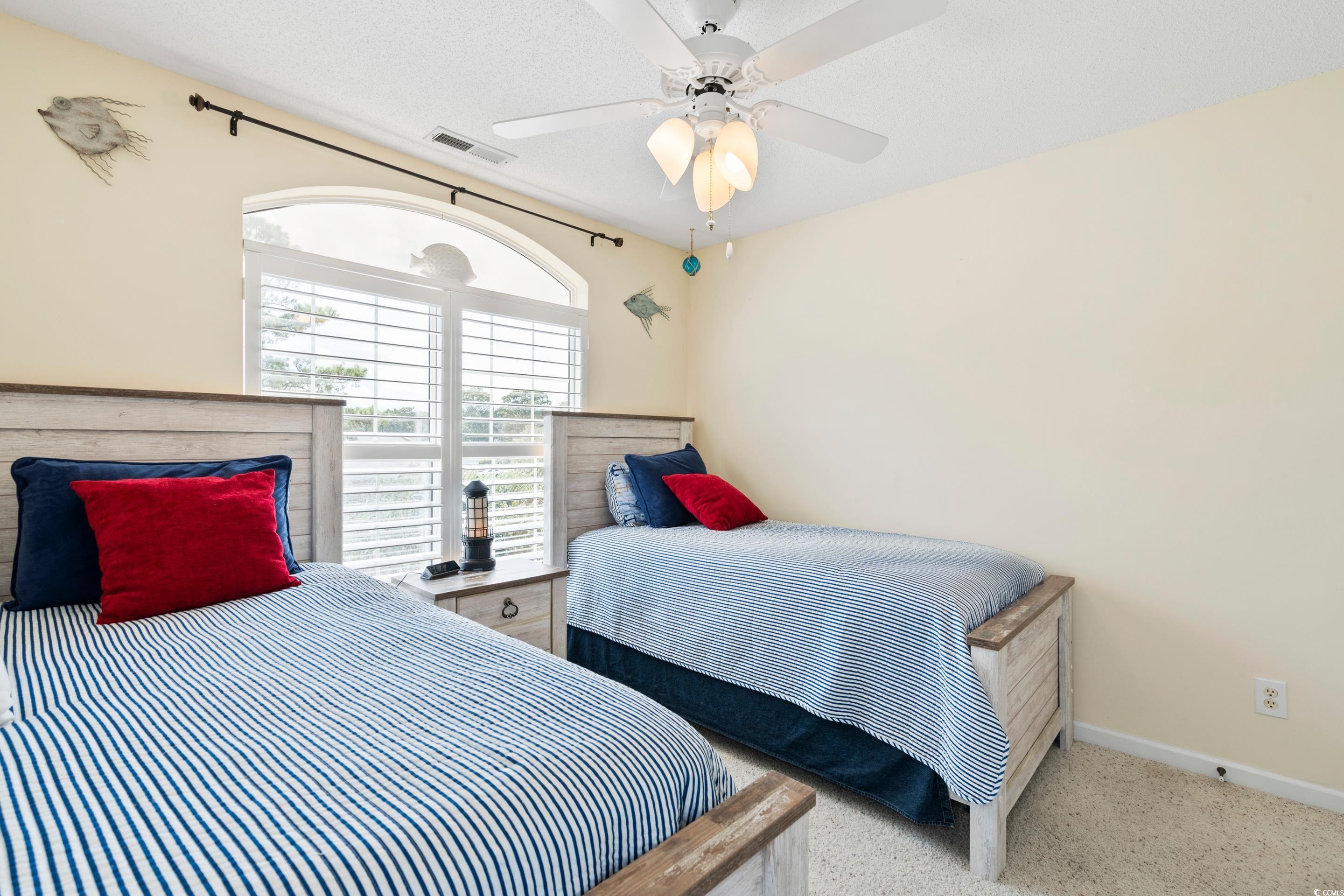 4629 Lightkeepers Way, Unit 6L Little River, SC 29566 - Photo 23 of 36 Bedroom featuring baseboards and ceiling fan