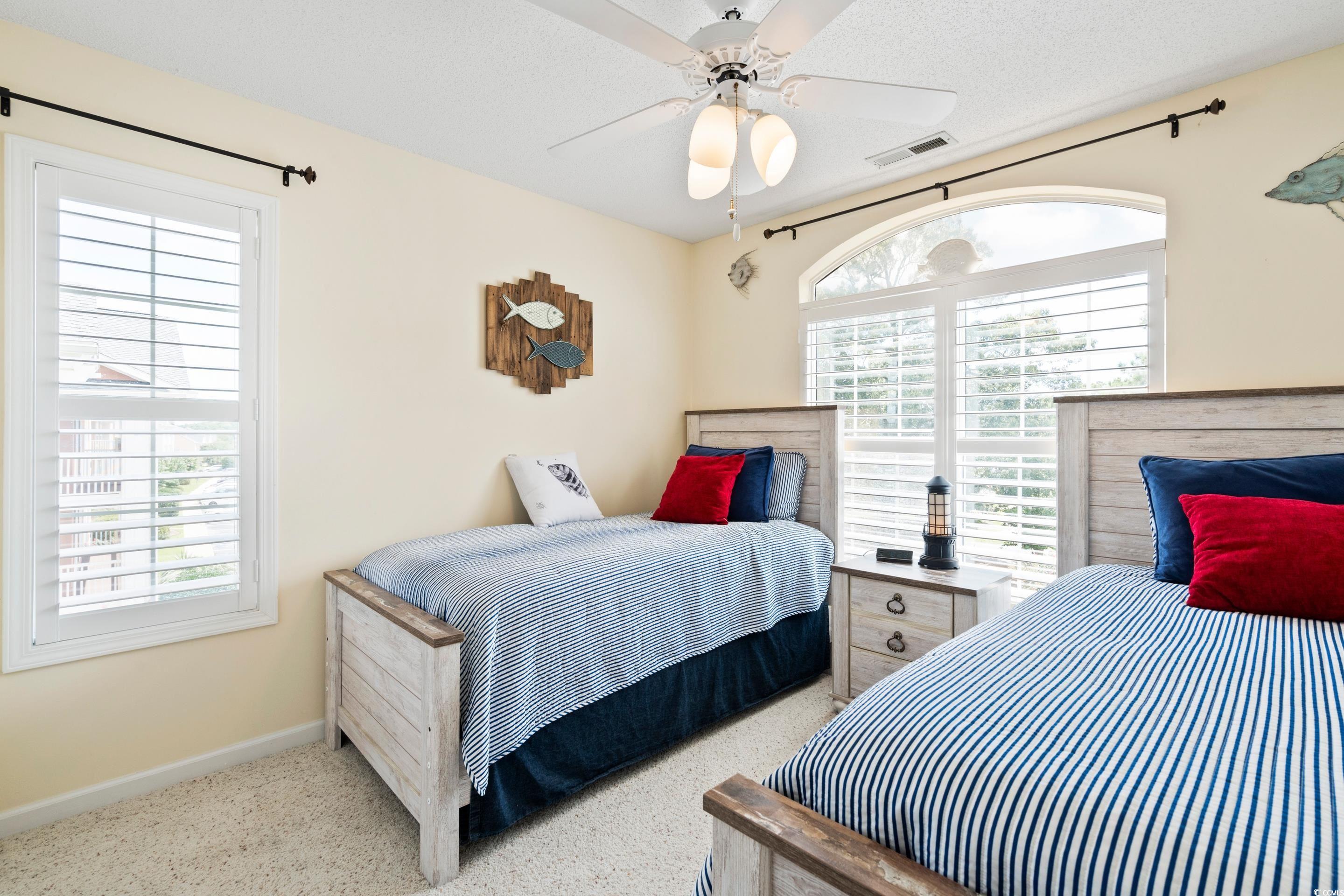 4629 Lightkeepers Way, Unit 6L Little River, SC 29566 - Photo 24 of 36 Bedroom with baseboards and a ceiling fan