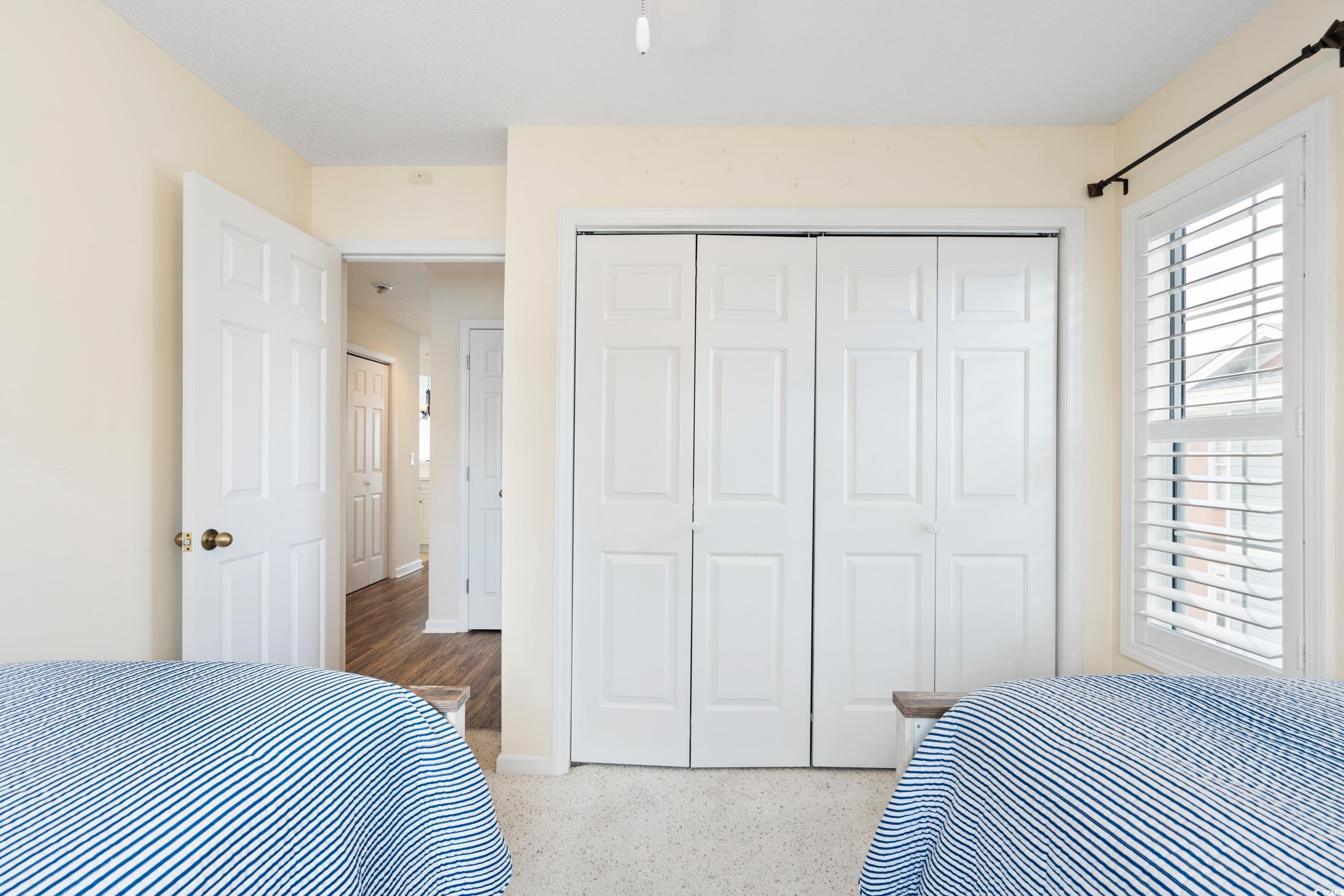 4629 Lightkeepers Way, Unit 6L Little River, SC 29566 - Photo 25 of 36 Bedroom with a closet and baseboards