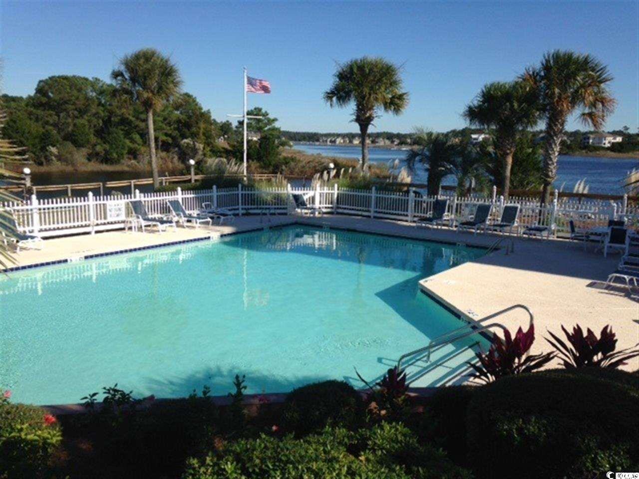 4629 Lightkeepers Way, Unit 6L Little River, SC 29566 - Photo 30 of 36 Community pool featuring a patio area