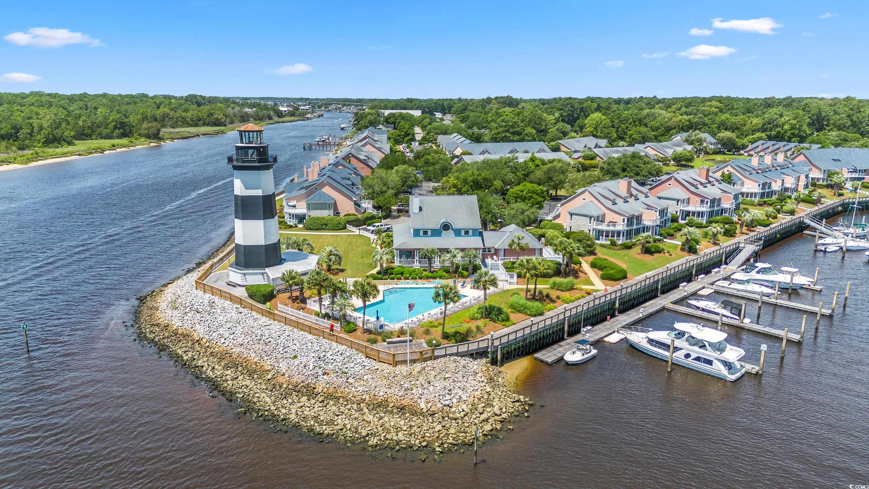 4629 Lightkeepers Way, Unit 6L Little River, SC 29566 - Photo 31 of 36 Community pool with a patio
