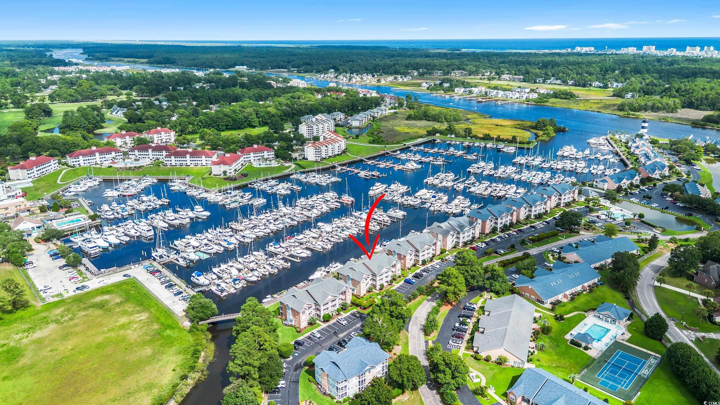 4629 Lightkeepers Way, Unit 6L Little River, SC 29566 - Photo 4 of 36 Drone / aerial view of a marina and a large body of water