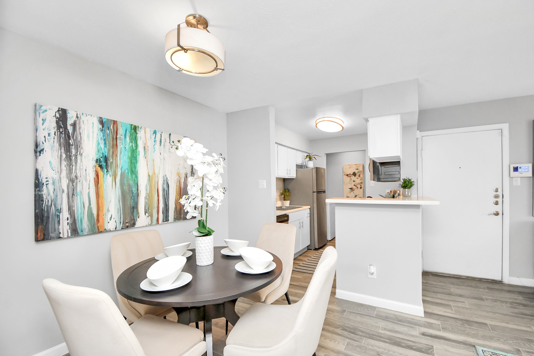 2701 West Bellfort Avenue, Unit 1004 Houston, TX 77054 - Photo 7 of 44 a view of a dining room with furniture and wooden floor