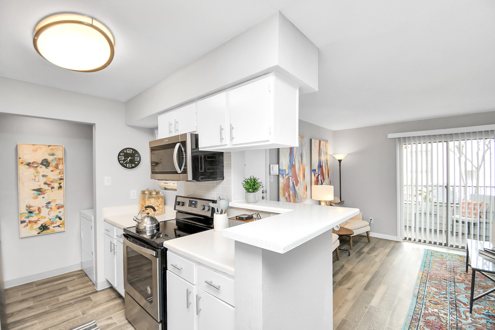 2701 West Bellfort Avenue, Unit 1004 Houston, TX 77054 - Photo 9 of 44 a kitchen with stainless steel appliances a stove a sink a microwave a refrigerator and cabinets