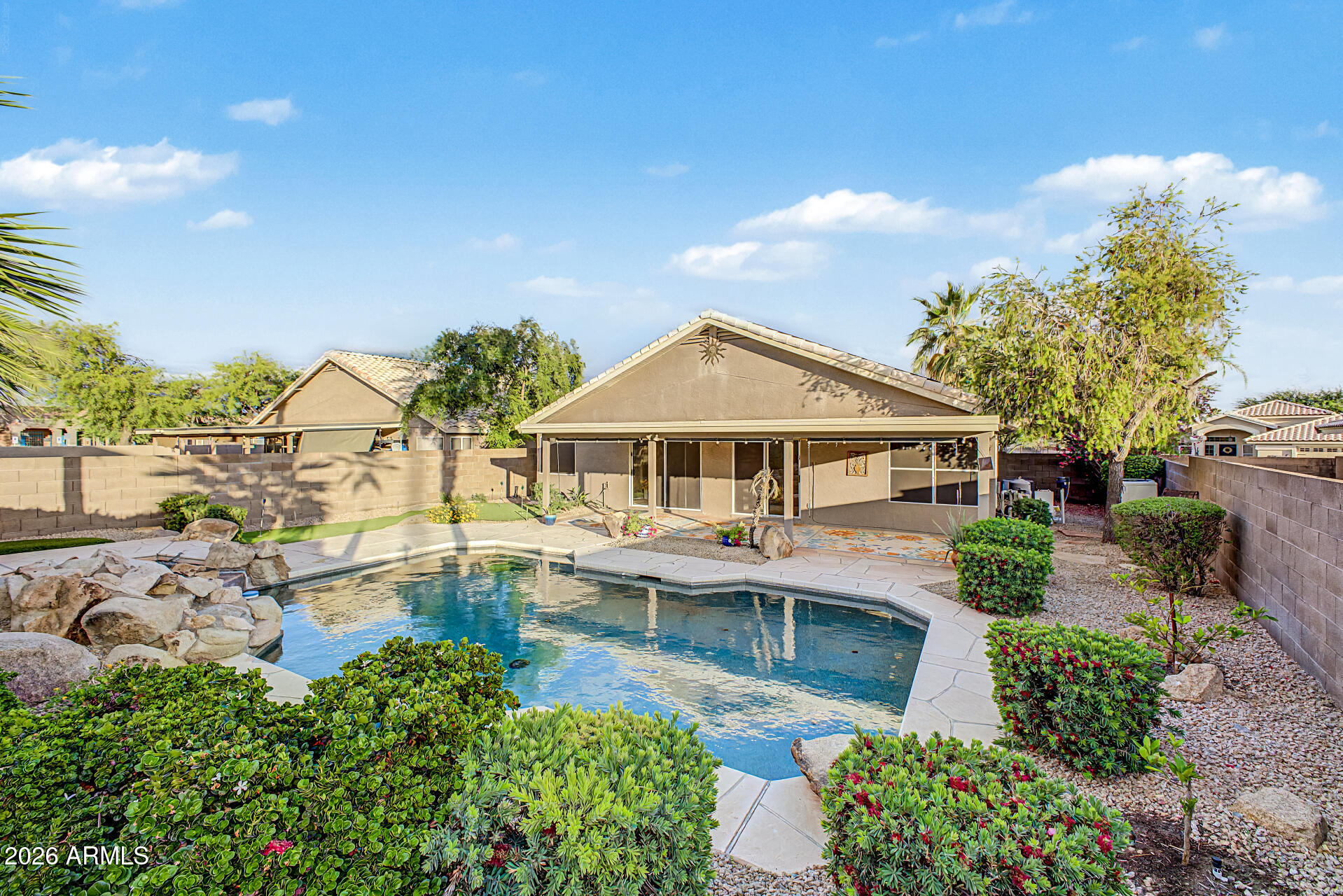4102 East Rock Wren Road Phoenix, AZ 85044 - Photo 1 of 25 a front view of a house with garden
