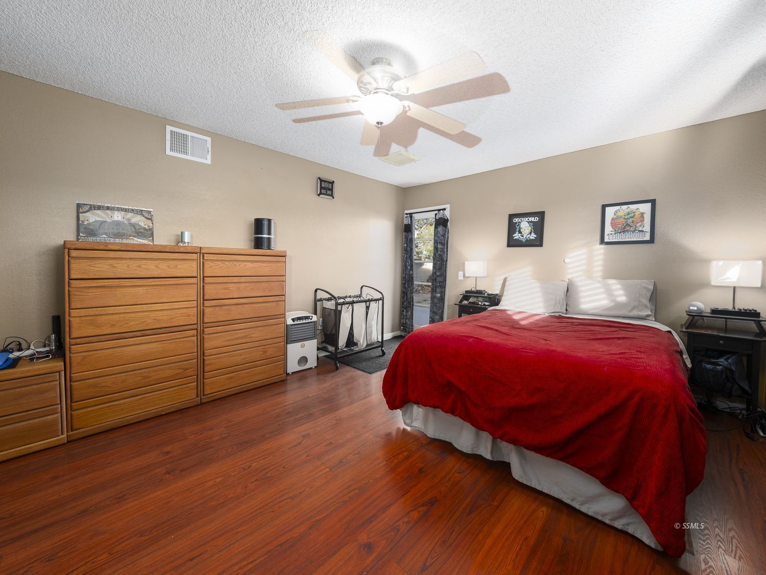 800 South Sanders Street Ridgecrest, CA 93555 - Photo 18 of 33 a bedroom with a bed and a chandelier