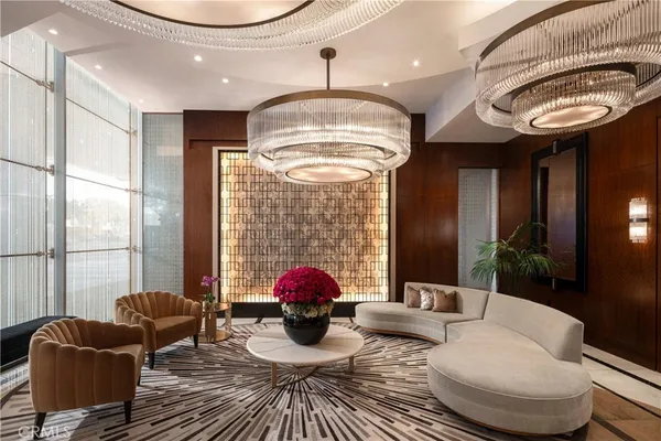 a very nice looking room with a large window and chandelier