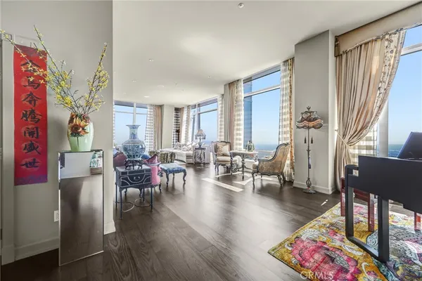 a view of livingroom with furniture wooden floor and windows