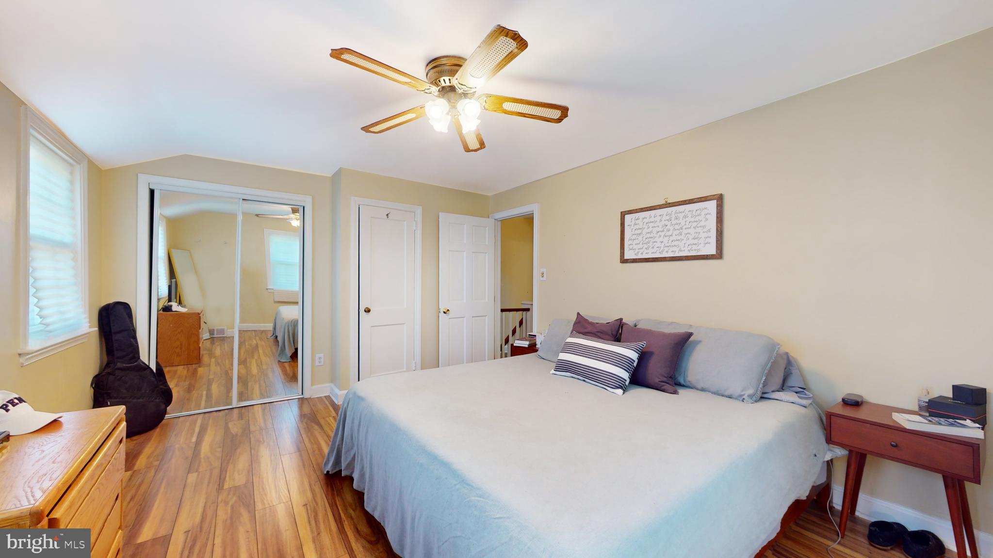 769 Ardmore Avenue Ardmore, PA 19003 - Photo 16 of 40 a bedroom with a large bed and a chandelier