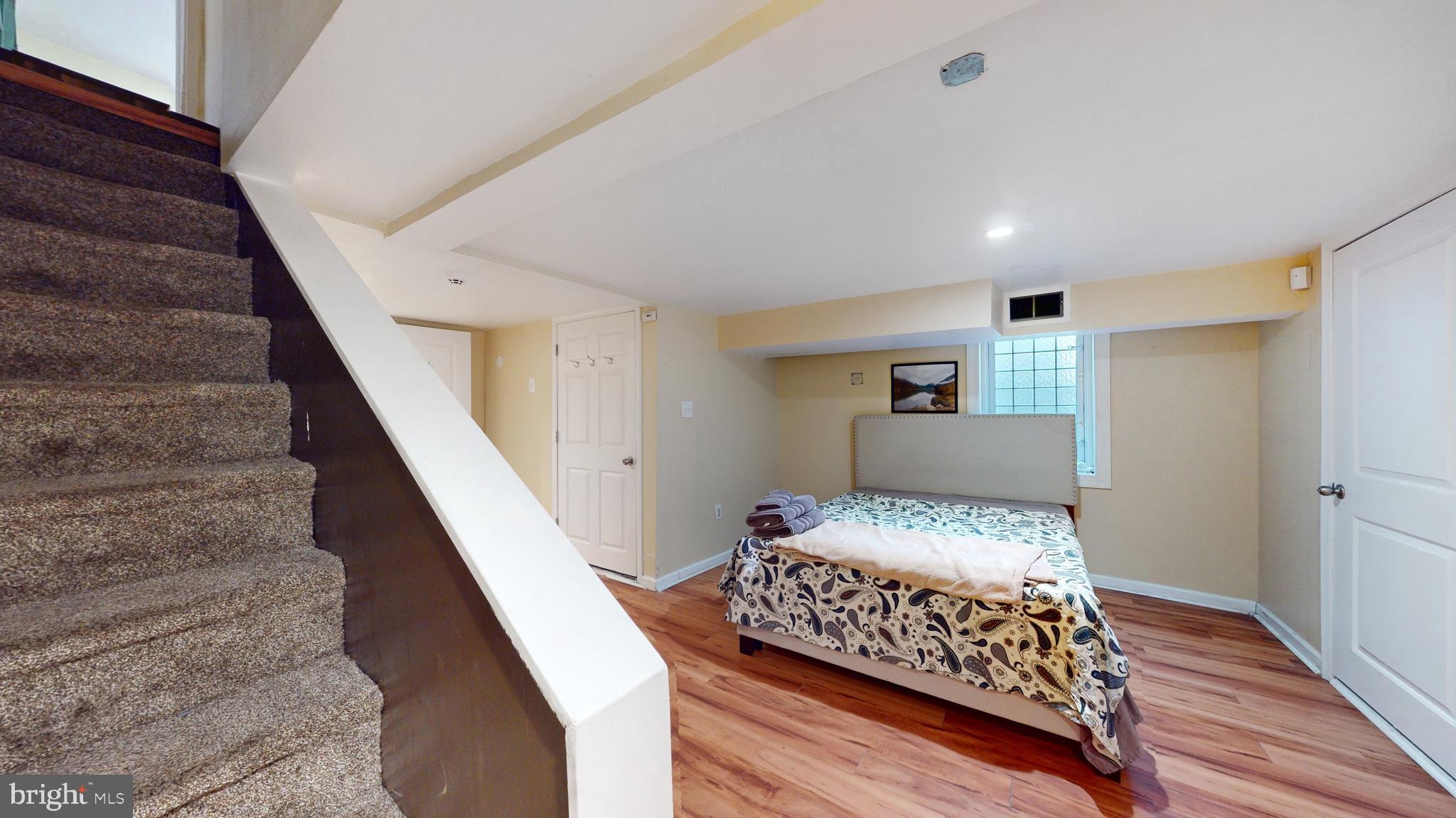 769 Ardmore Avenue Ardmore, PA 19003 - Photo 24 of 40 a bedroom with a bed and wooden floor