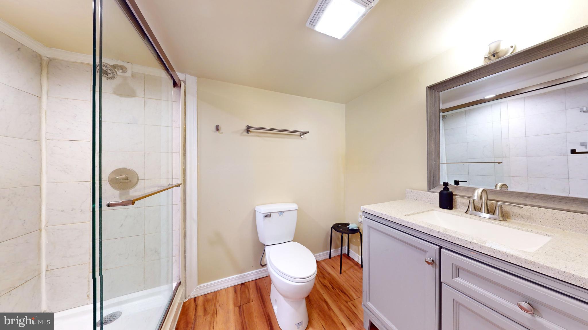769 Ardmore Avenue Ardmore, PA 19003 - Photo 27 of 40 a bathroom with a toilet sink and shower