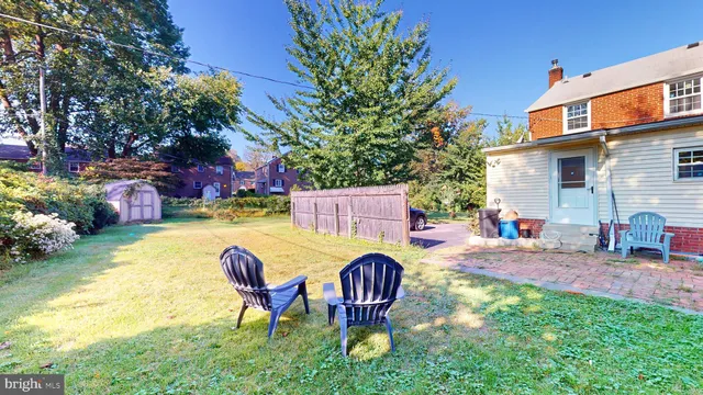 a view of a backyard with swimming pool