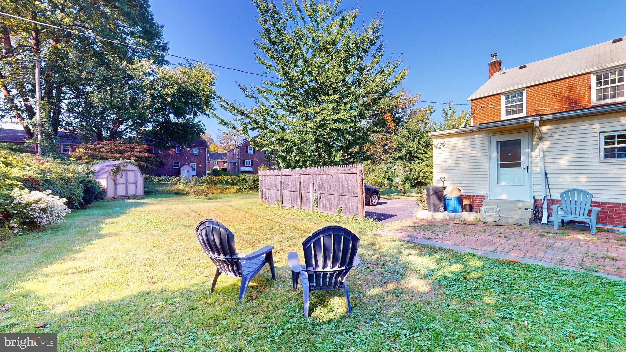 769 Ardmore Avenue Ardmore, PA 19003 - Photo 31 of 40 a view of a backyard with table and chairs and potted plants
