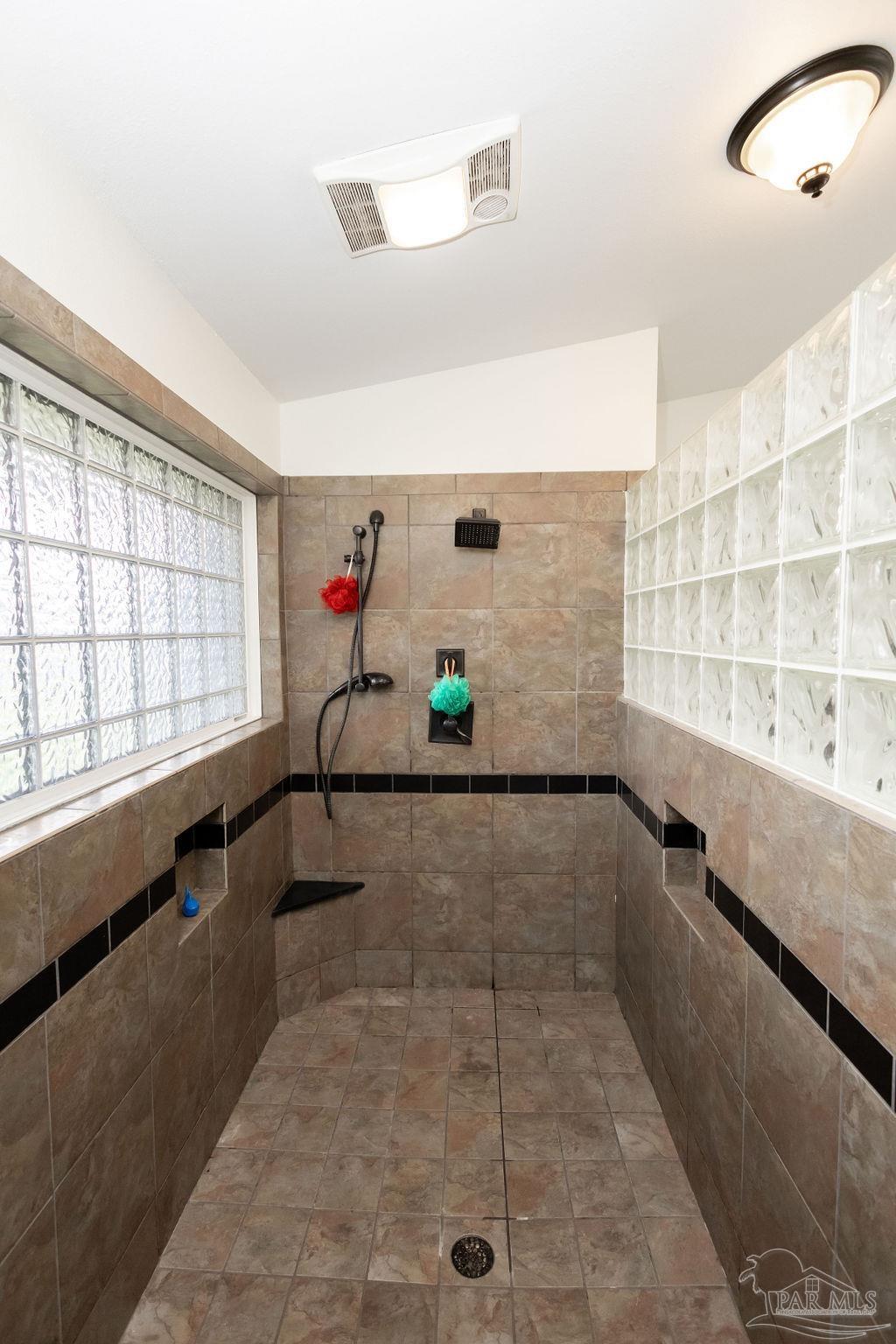 3059 Cobblestone Drive Pace, FL 32571 - Photo 27 of 45 a hallway with a large window