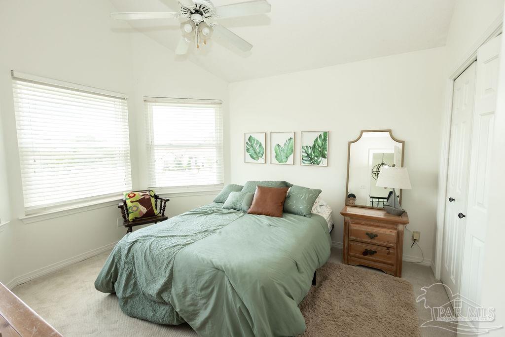 3059 Cobblestone Drive Pace, FL 32571 - Photo 28 of 45 a bedroom with a bed and a window