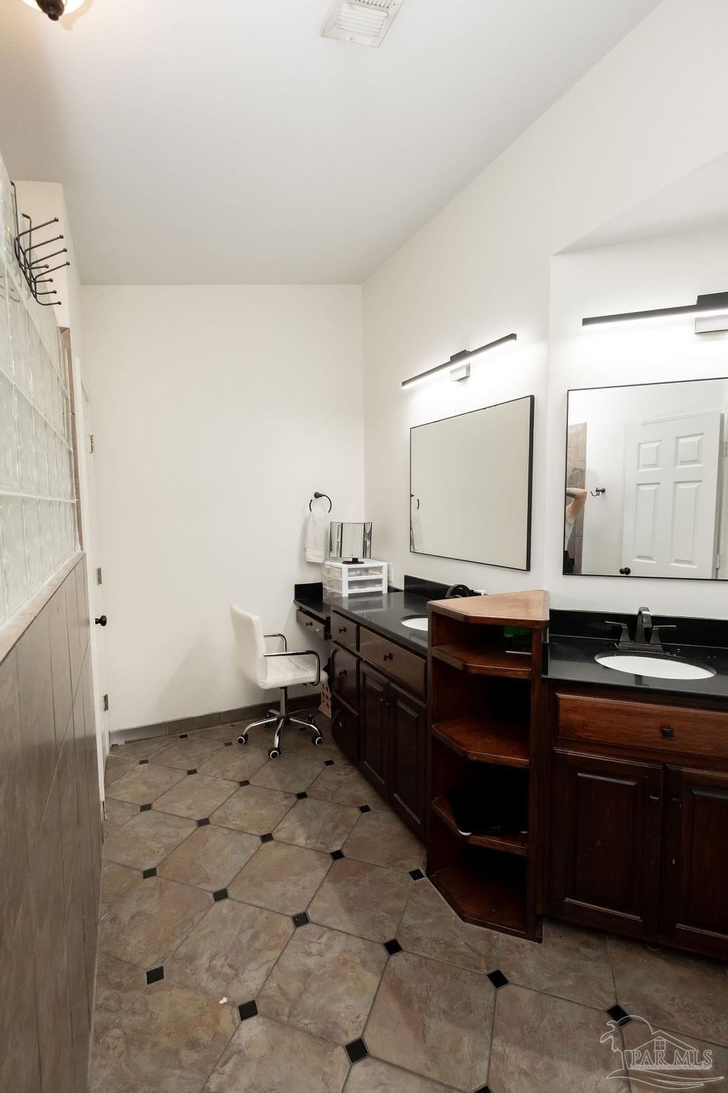 3059 Cobblestone Drive Pace, FL 32571 - Photo 29 of 45 a kitchen with a sink and cabinets