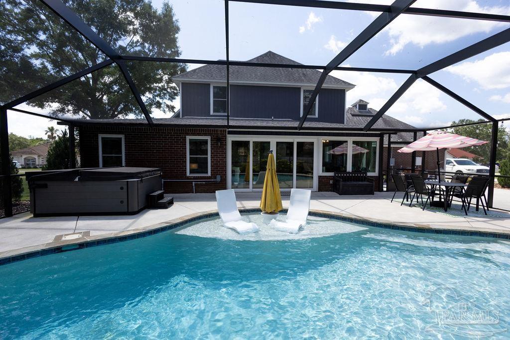 3059 Cobblestone Drive Pace, FL 32571 - Photo 3 of 45 a view of a house with backyard porch and sitting area