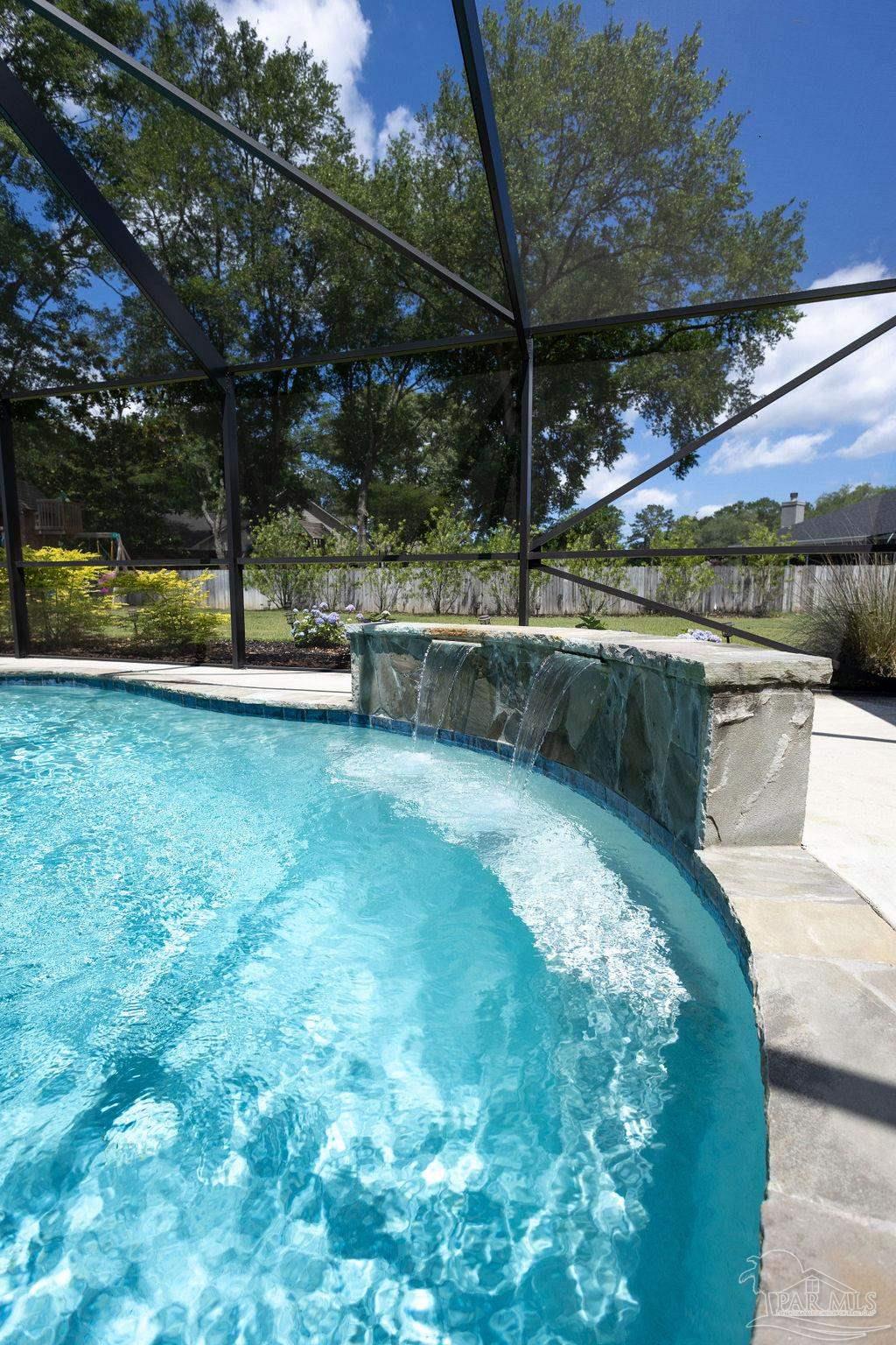 3059 Cobblestone Drive Pace, FL 32571 - Photo 34 of 45 a view of a backyard with swimming pool
