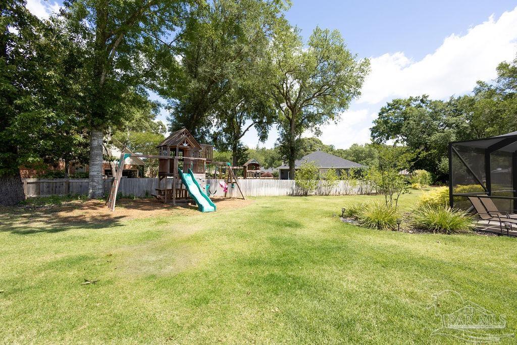 3059 Cobblestone Drive Pace, FL 32571 - Photo 36 of 45 a view of a yard with basketball court