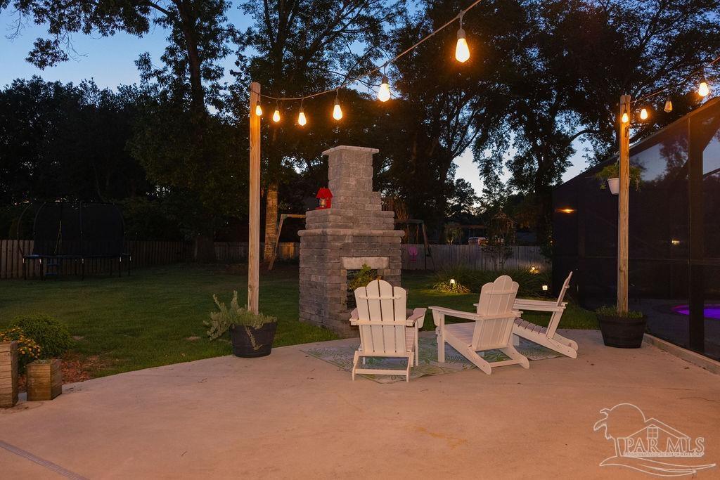 3059 Cobblestone Drive Pace, FL 32571 - Photo 41 of 45 a view of a patio with a yard