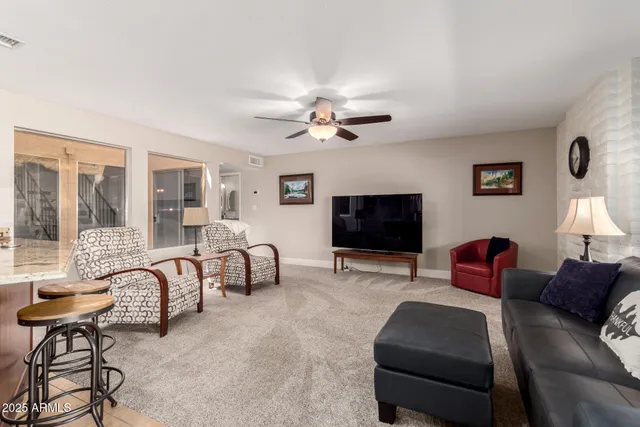 a living room with furniture and a gate