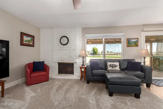 a kitchen with sink refrigerator dining table and chairs