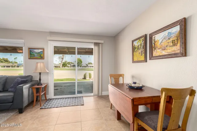a kitchen with granite countertop cabinets stainless steel appliances and wooden floor