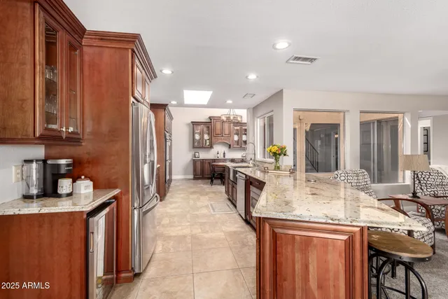 a living room with a bed couch and a large window