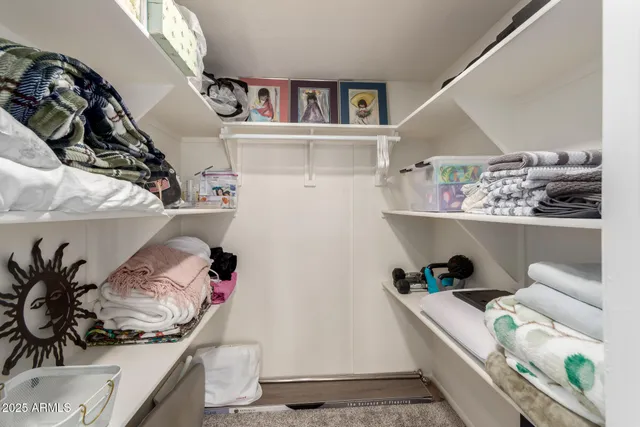 a bed room with a bed and a tv