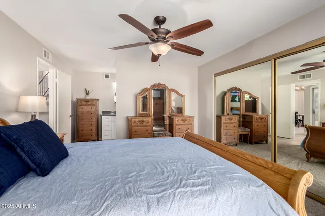 an aerial view of a residential houses with outdoor space and river