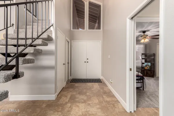 a view of entryway and hall with dining room