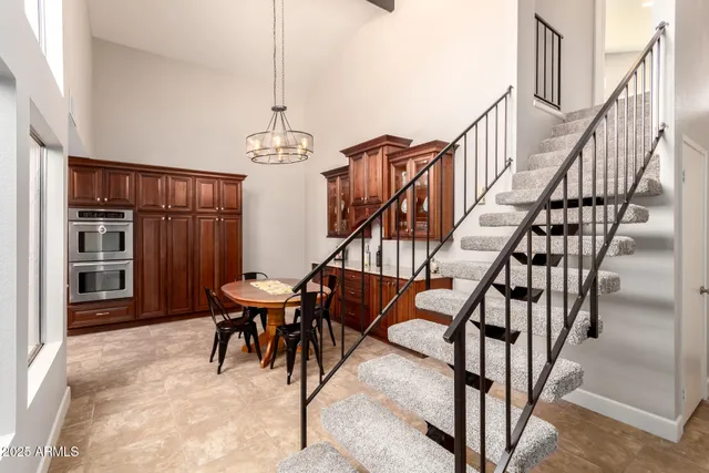 a living room with furniture a fireplace and a table