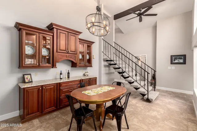 a living room with furniture and kitchen view