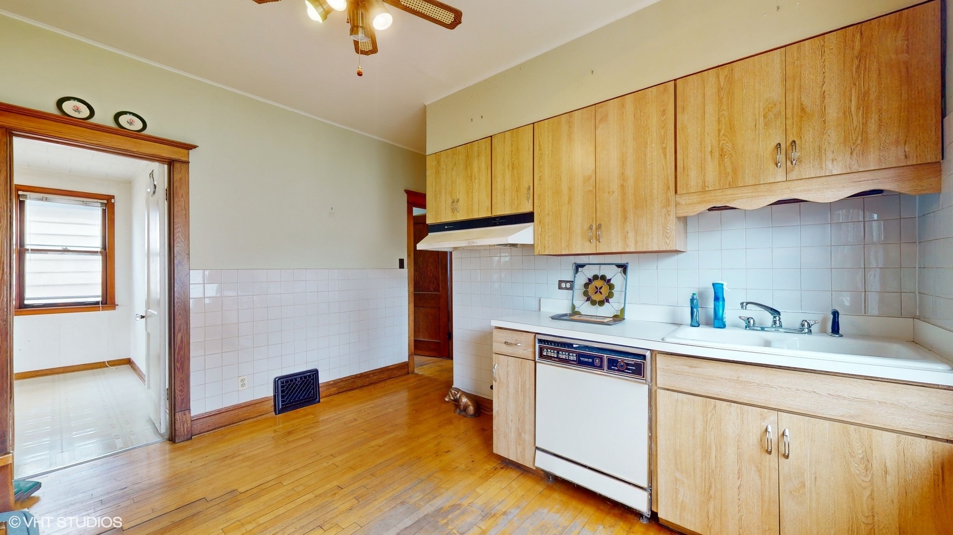 1035 South Ridgeland Avenue Oak Park, IL 60304 - Photo 11 of 43 a kitchen with a sink cabinets and wooden floor
