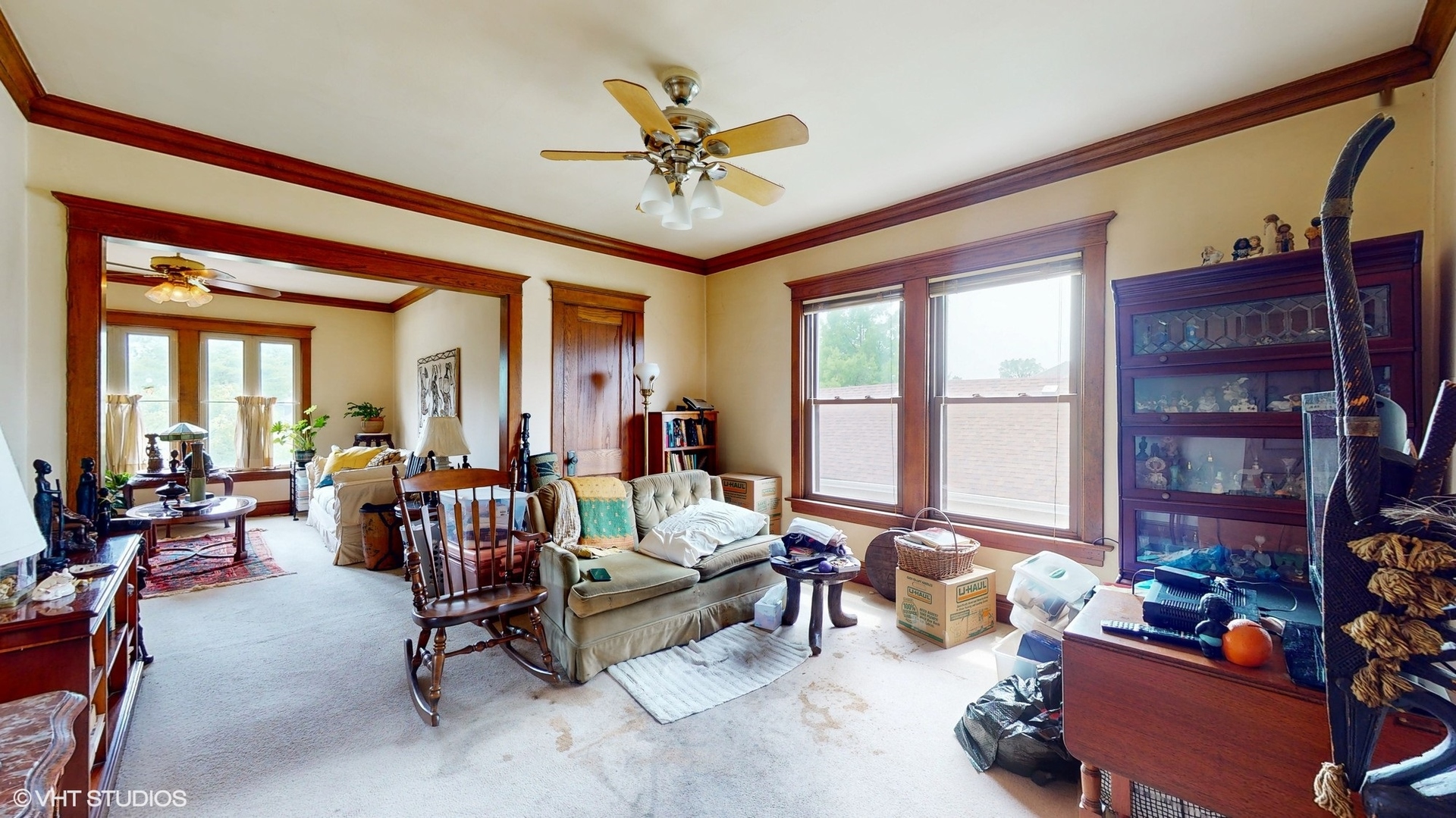 1035 South Ridgeland Avenue Oak Park, IL 60304 - Photo 24 of 43 a living room with furniture a large window and a chandelier