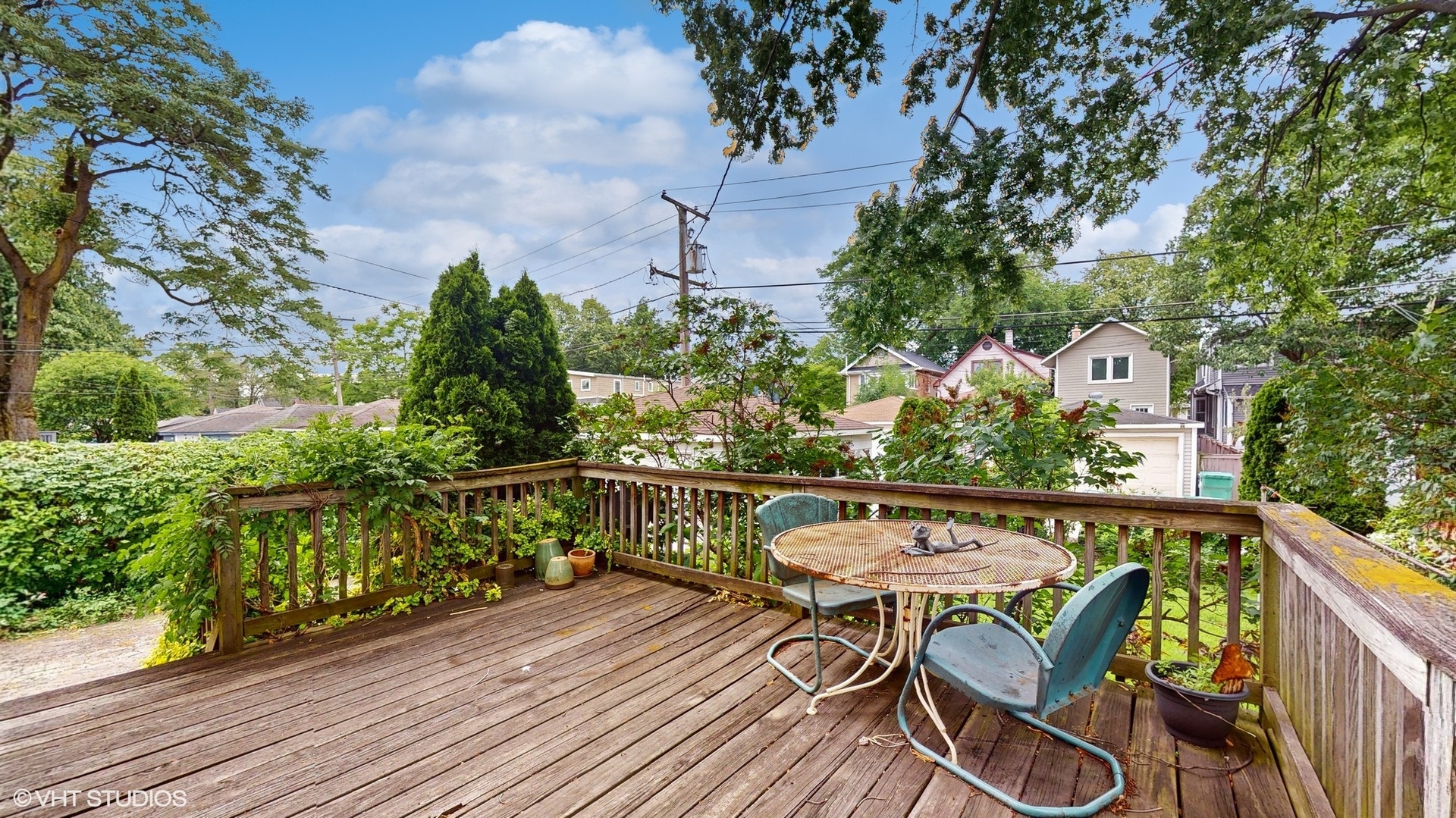 1035 South Ridgeland Avenue Oak Park, IL 60304 - Photo 36 of 43 a balcony with wooden floor table and chairs