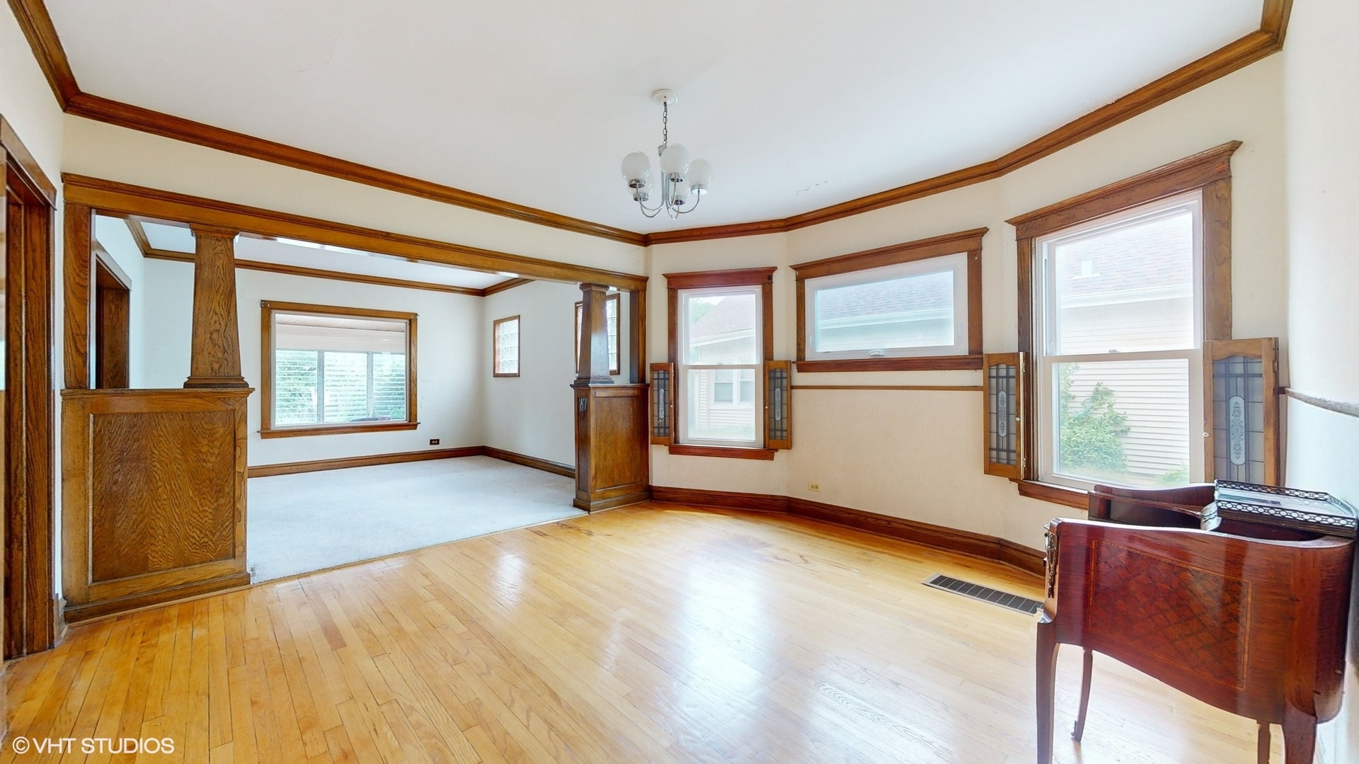 1035 South Ridgeland Avenue Oak Park, IL 60304 - Photo 9 of 43 a view of an empty room with a window and wooden floor