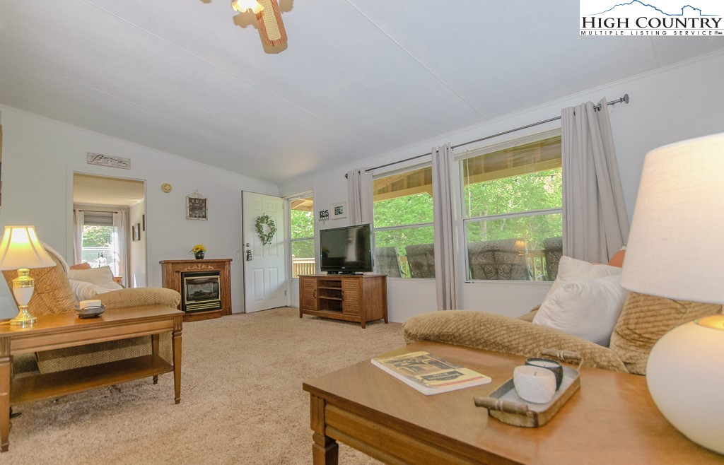 295 Roy E Brown Road Vilas, NC 28692 - Photo 18 of 43 a living room with furniture and a large window