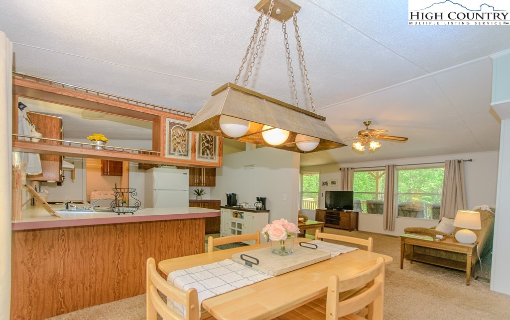 295 Roy E Brown Road Vilas, NC 28692 - Photo 27 of 43 a view of a dining room with furniture window and outside view