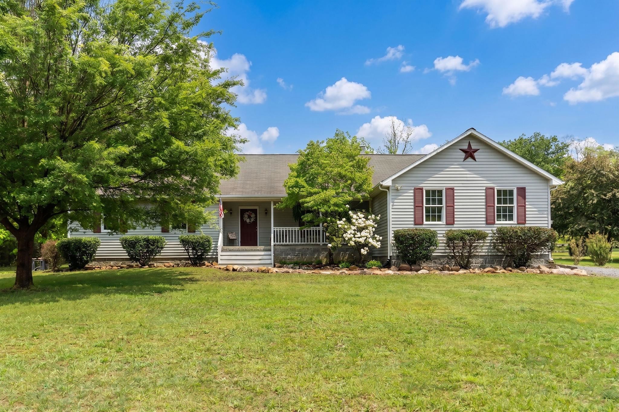 516 Estaline Valley Road Craigsville, VA 24430 - Photo 1 of 75 a front view of house with yard and green space