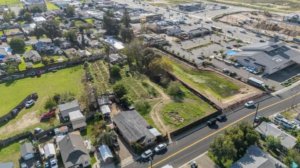 an aerial view of residential houses and outdoor space