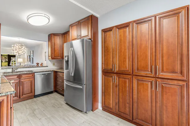 a view of a bedroom with wooden floor and a window