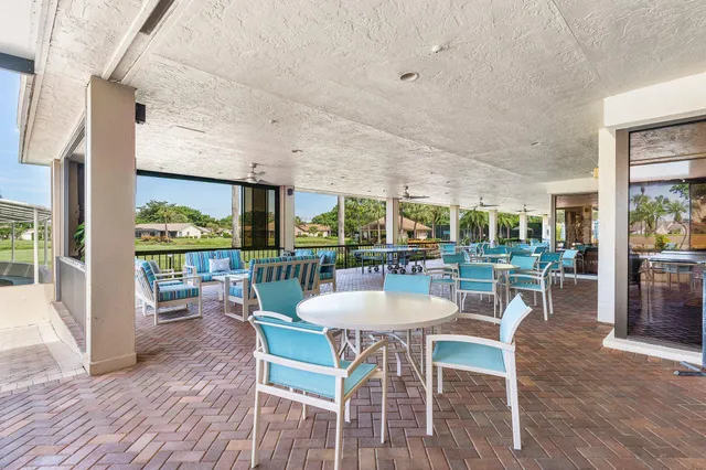 a room with lots of furniture and a view of living room