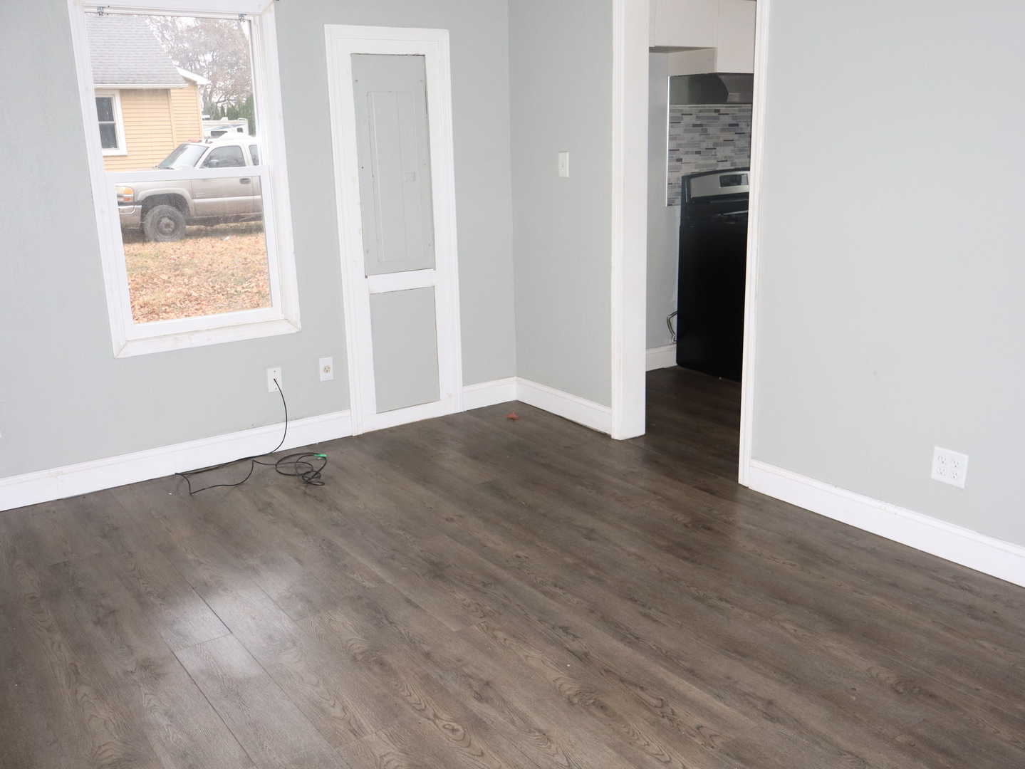 4603 Cleveland Street Streator, IL 61364 - Photo 8 of 16 an empty room with wooden floor and windows