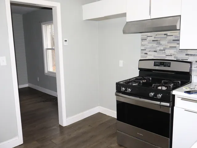 a kitchen with a stove and a microwave