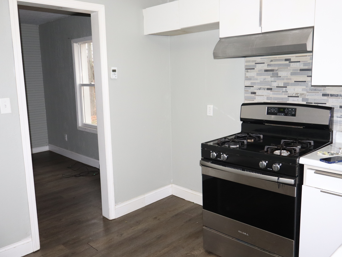 4603 Cleveland Street Streator, IL 61364 - Photo 10 of 16 a kitchen with a stove and a microwave