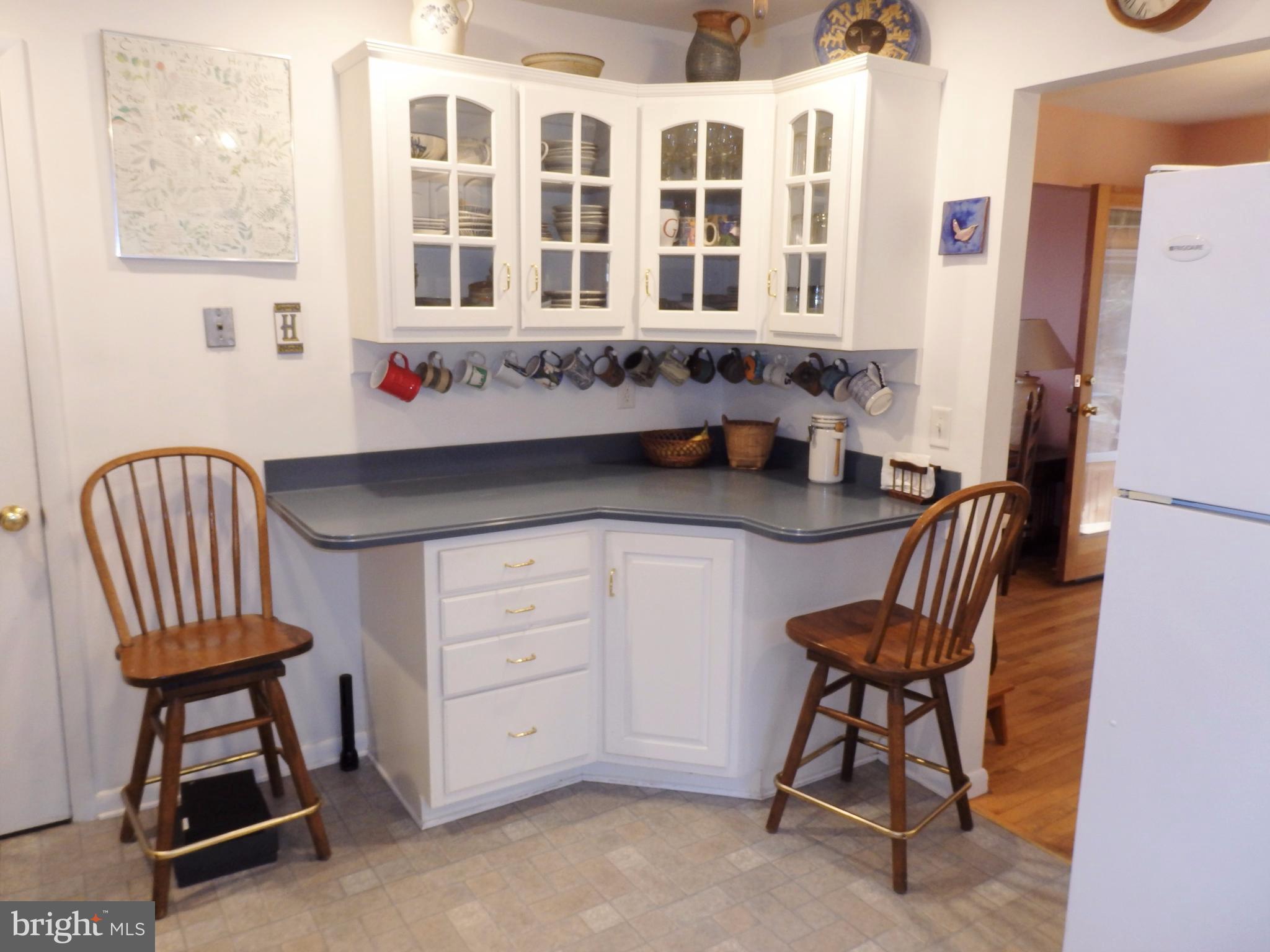 9308 View Court Frederick, MD 21701 - Photo 12 of 30 Pretty glass cabinets and counter space seating