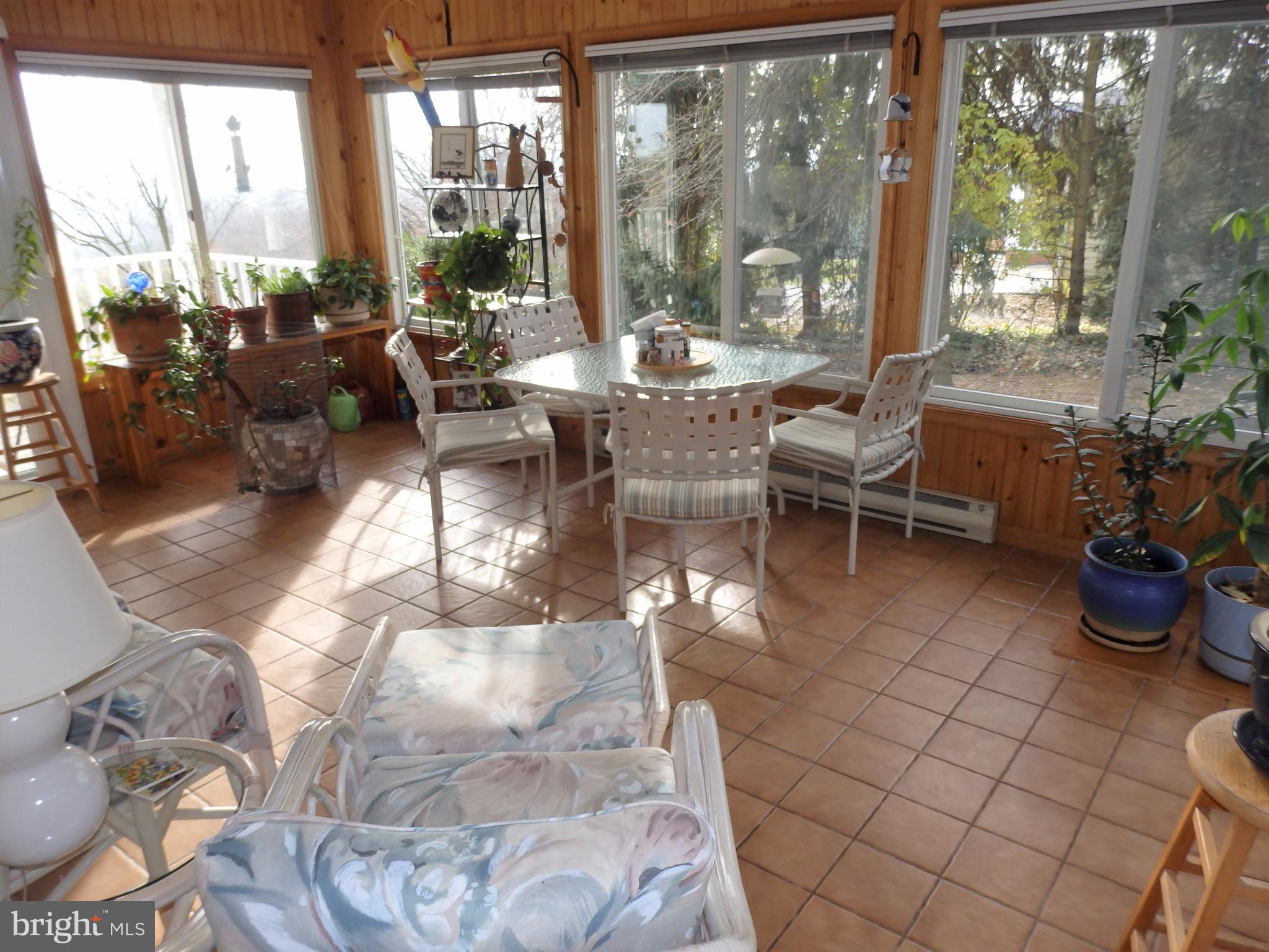 9308 View Court Frederick, MD 21701 - Photo 9 of 30 Sunroom has ceramic flooring and beadboard walls.