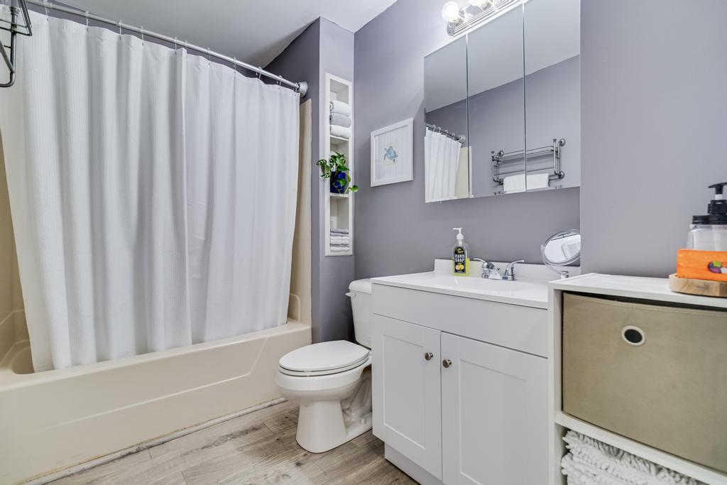 323 Laurel Drive Lusby, MD 20657 - Photo 13 of 15 a bathroom with a sink a toilet and shower