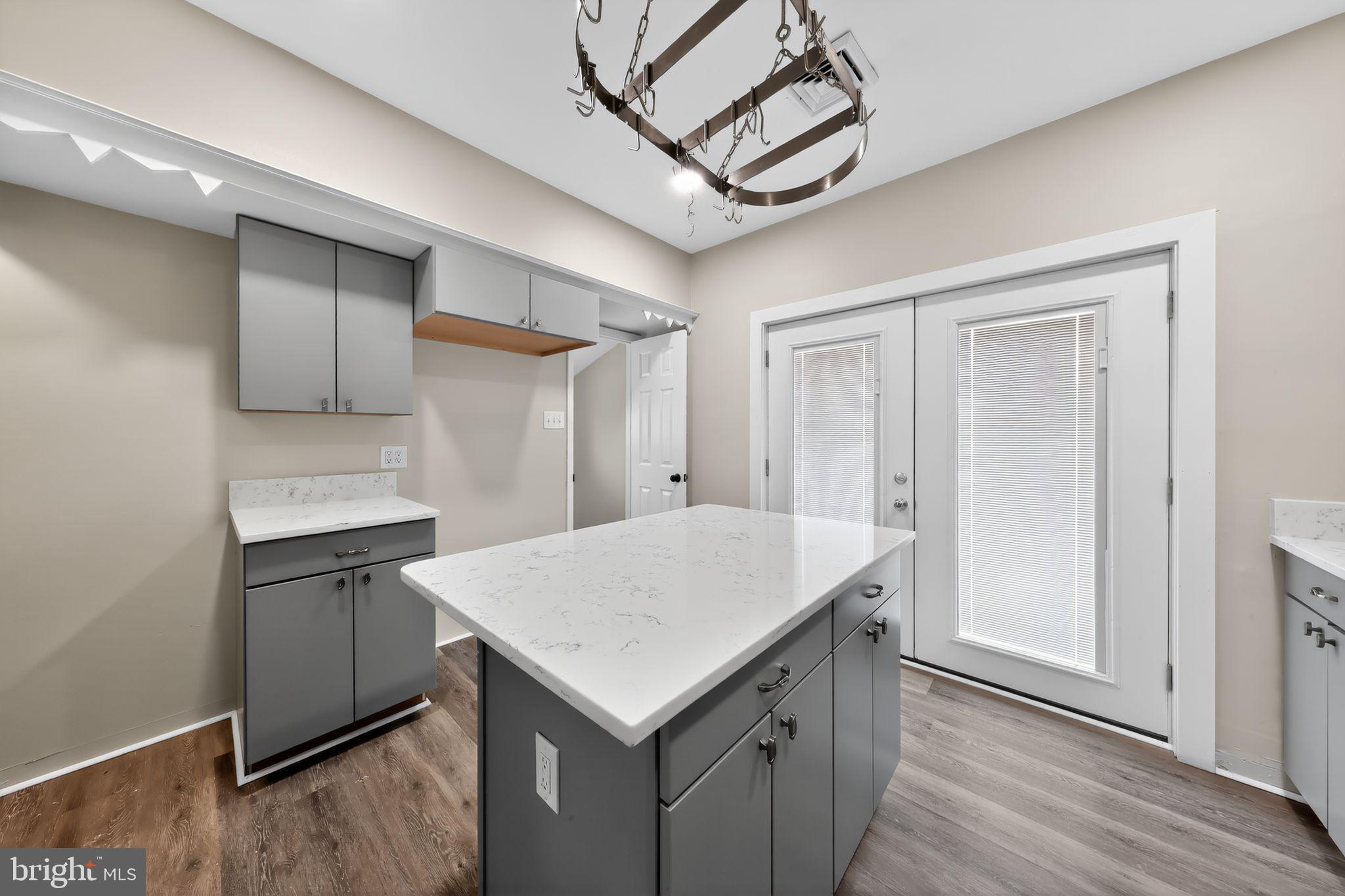 121 Ash Street Carneys Point, NJ 08069 - Photo 13 of 30 a kitchen with a refrigerator a sink and cabinets